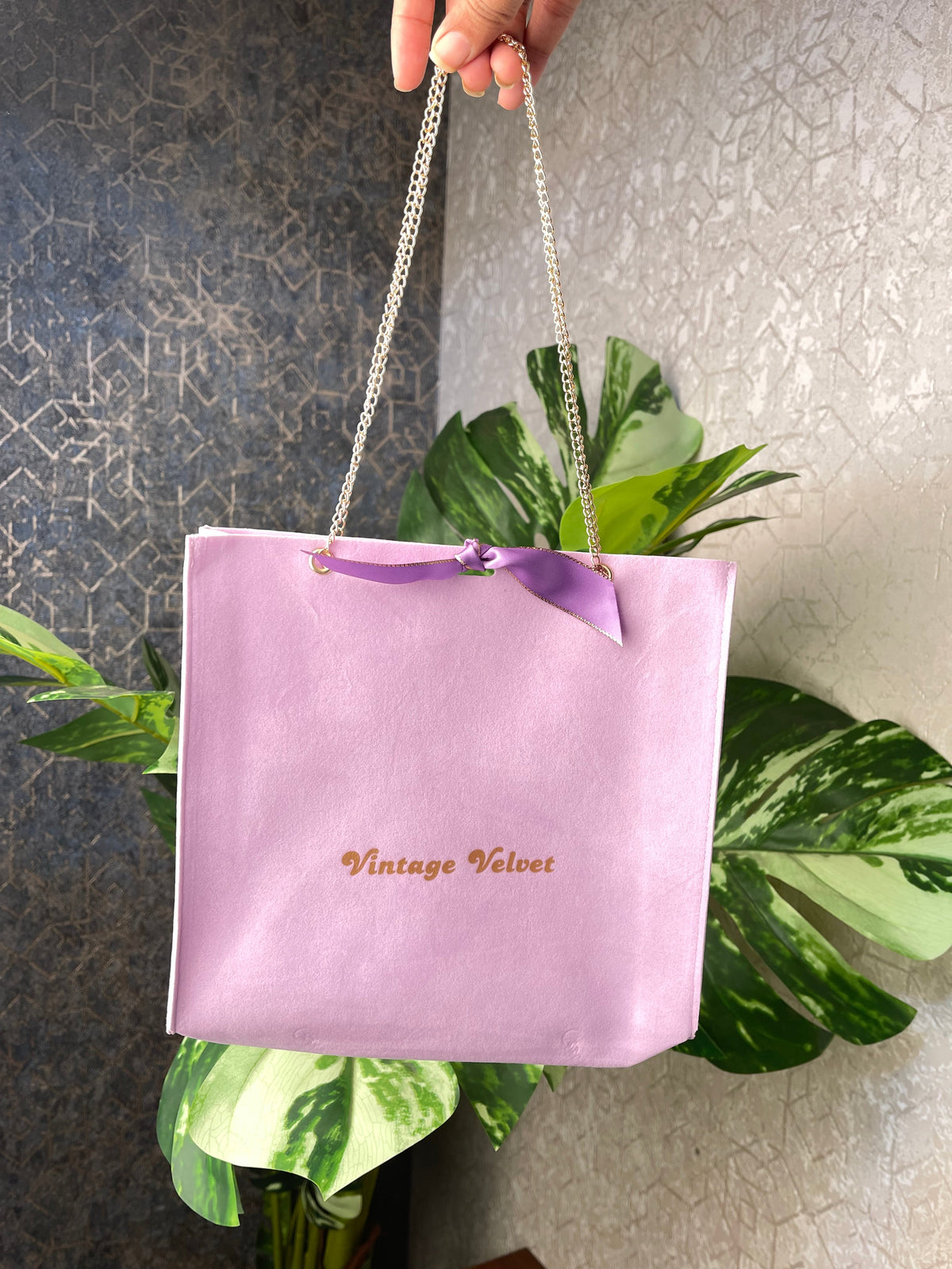 Lilac suede gift pouch with brass metal chain and ribbon
